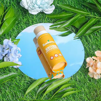 Two bottles of 'Bacardi' on a blue circular background surrounded by green leaves and flowers.